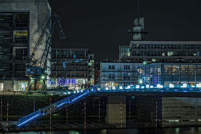 View of buildings in city at night