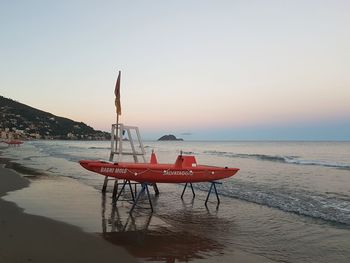 Lifeguard hut on beach against clear sky