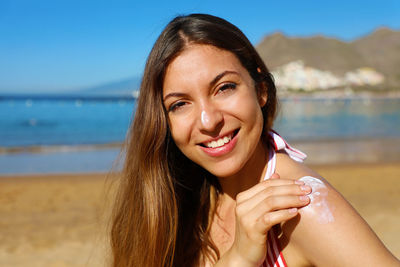 Portrait of a smiling young woman on beach