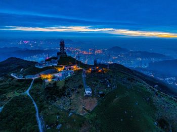 High angle view of illuminated buildings in city