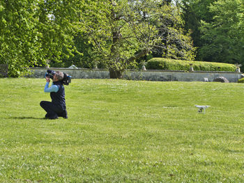 Man photographing in park