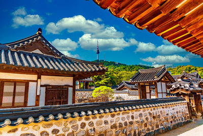 Exterior of houses and buildings against sky