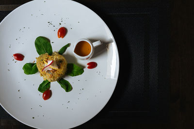 High angle view of fruits in plate on table