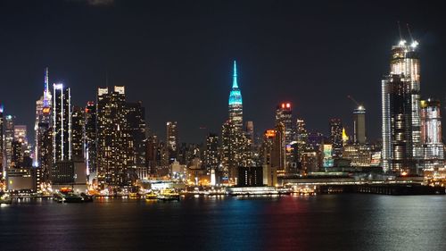Illuminated city buildings at night