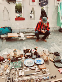 High angle view of people sitting on table