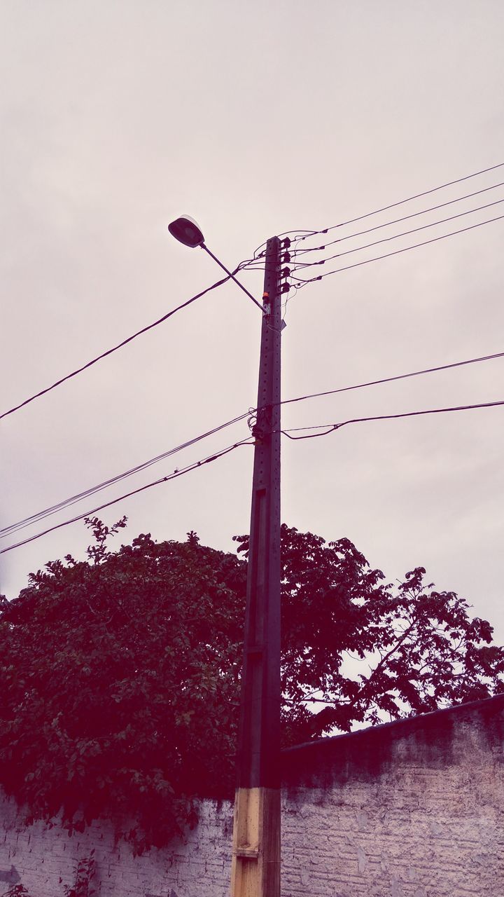low angle view, power line, clear sky, connection, cable, power supply, electricity, electricity pylon, sky, fuel and power generation, bird, power cable, outdoors, nature, no people, day, perching, copy space, technology, hanging