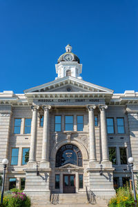 Low angle view of building against blue sky