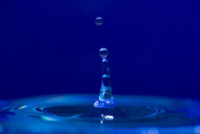 Close-up of water drop against black background