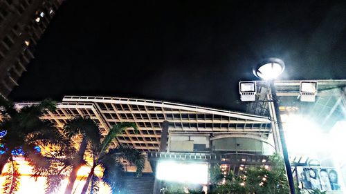 Low angle view of illuminated street light at night