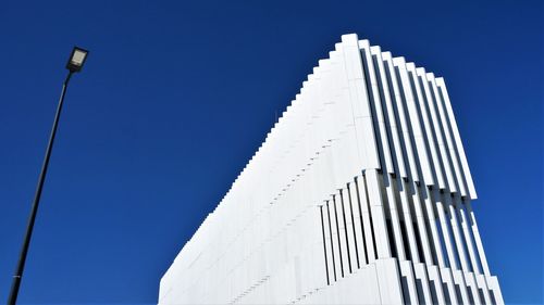 Low angle view of building against clear blue sky