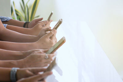 Close-up of woman hand on table