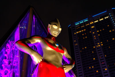 Low angle view of statue at night