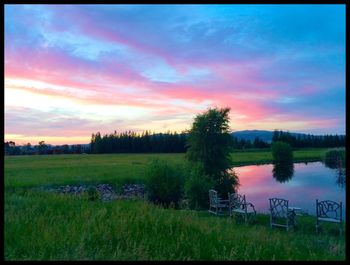 Scenic view of lake against sky during sunset