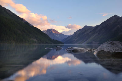 Scenic view of snowcapped mountains against sky during sunset