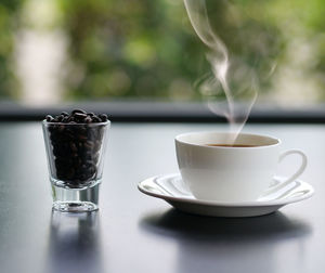 Close-up of coffee cup on table