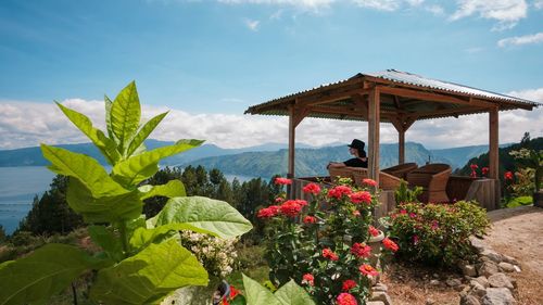 Woman sitting in gazebo