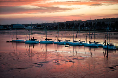 Boat in sea at sunset