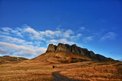 Man landscape against blue sky