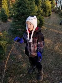 Boy standing in park