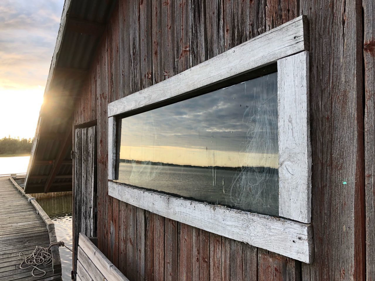 REFLECTION OF SKY ON WINDOW