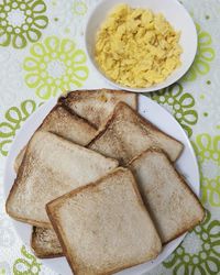 Directly above shot of toasted bread in plate on table