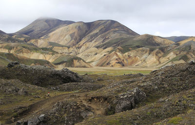 Landscape with mountain range in the background