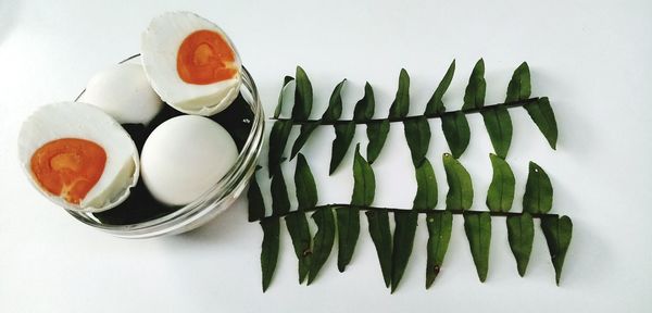 High angle view of breakfast on table against white background