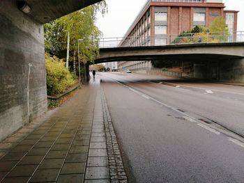 Road amidst buildings in city