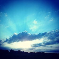 Scenic view of landscape against cloudy sky