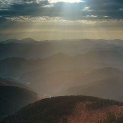 Scenic view of mountains against sky during sunset