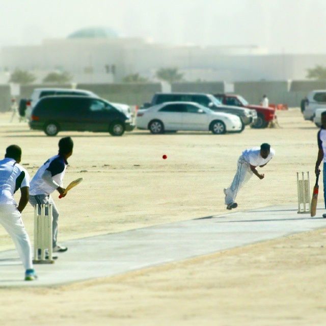 lifestyles, leisure activity, sport, focus on foreground, selective focus, men, street, full length, city, walking, competition, transportation, road, city life, motion, day, on the move, childhood, playing