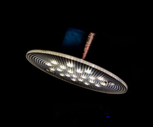 Close-up of electric light over black background