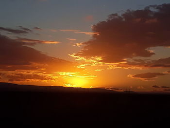 Scenic view of silhouette landscape against sky during sunset