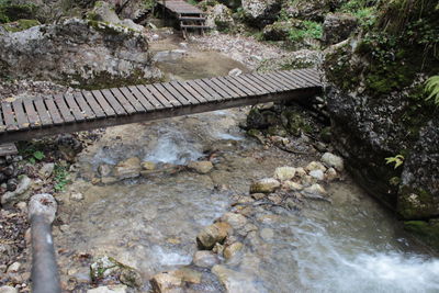 High angle view of bridge over stream