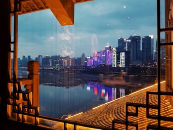 Cityscape against sky seen through window