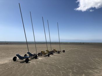 People on beach against sky