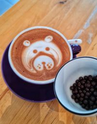 High angle view of cappuccino served on table