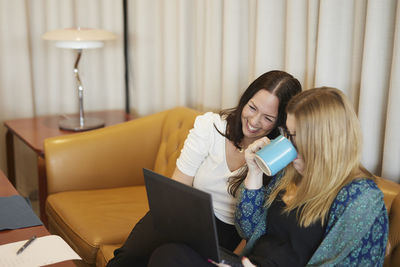 Women using laptop at work