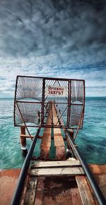 Pier over sea against sky