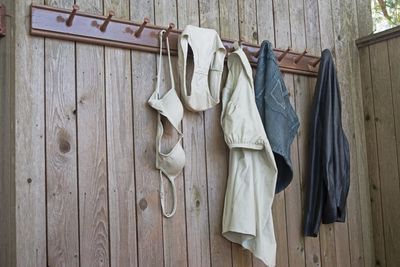 Low angle view of clothes hanging on hooks at home