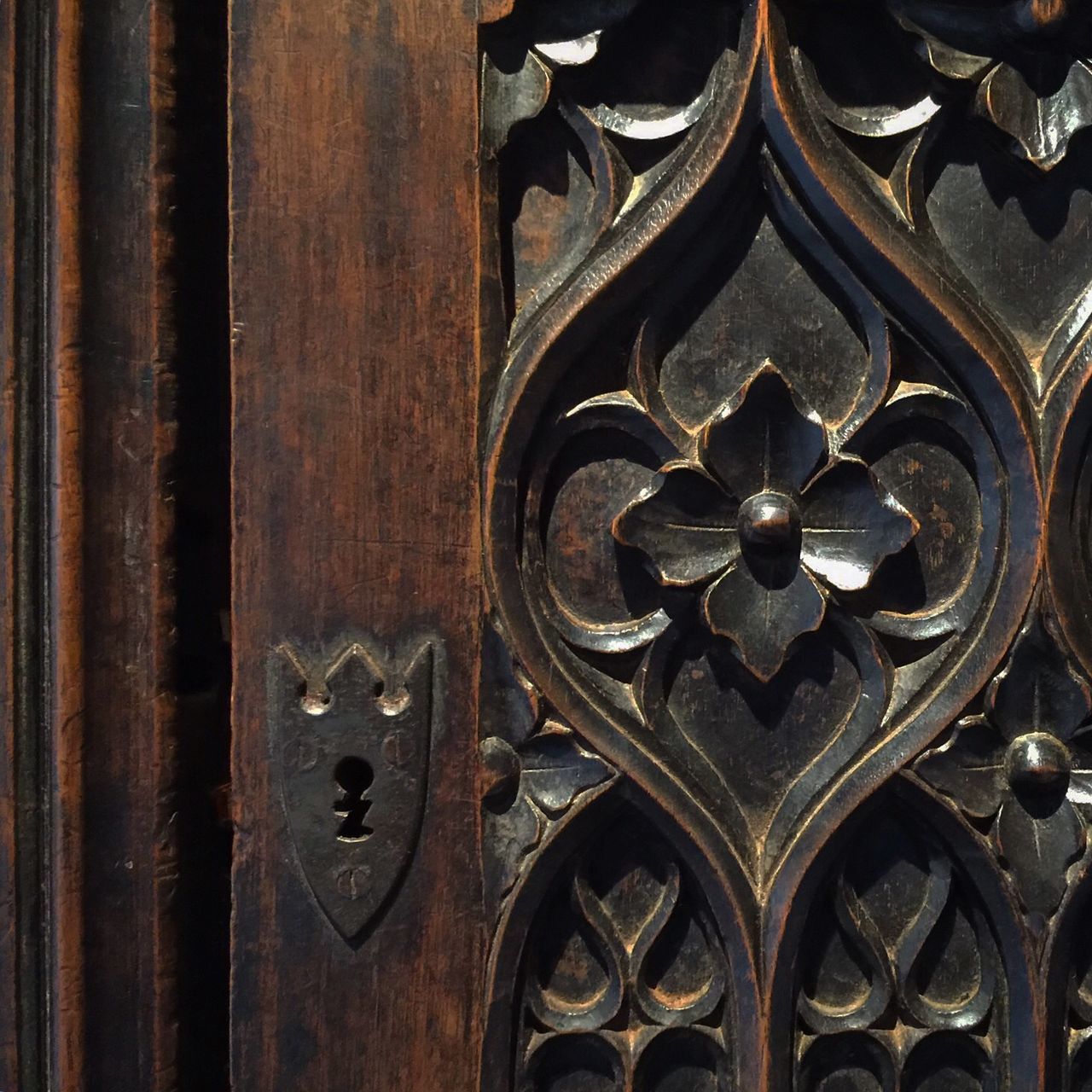 indoors, religion, place of worship, spirituality, church, ornate, built structure, architecture, wood - material, hanging, design, full frame, old, low angle view, backgrounds, pattern, close-up, door