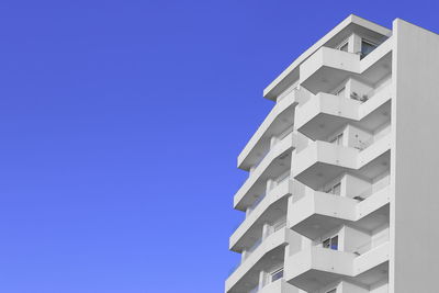 White building against blue sky