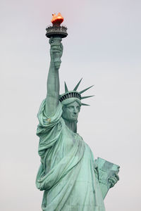 Low angle view of statue against sky