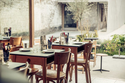 Empty chairs and tables in cafe