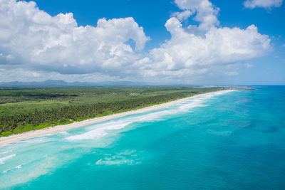 View of calm blue sea against cloudy sky