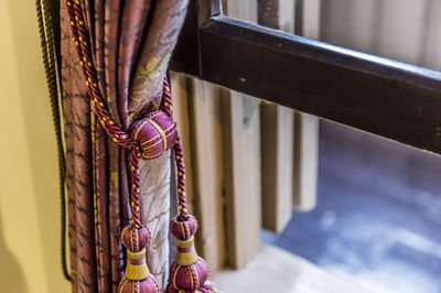 Close-up of decoration hanging on railing