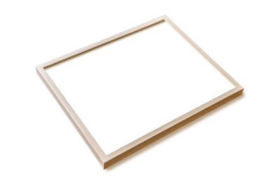High angle view of empty chairs against white background