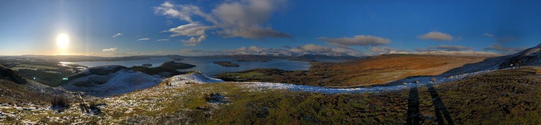 Panoramic view of mountains against sky during winter