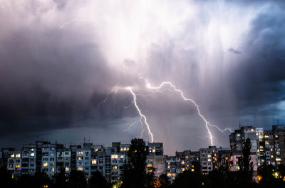 Lightning in sky over city