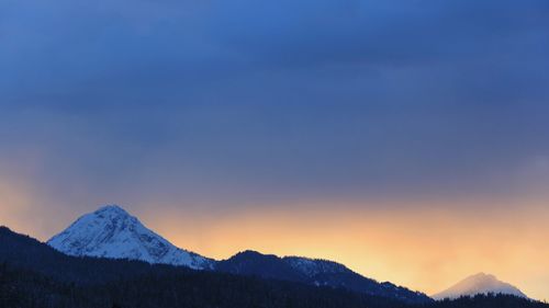 Scenic view of mountains against sky during sunset